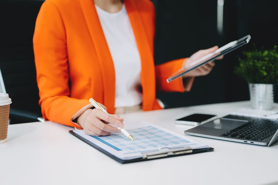 Close up of a working woman on a tablet