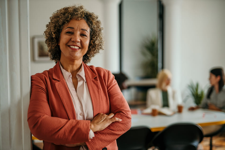 Smiling senior business woman posing