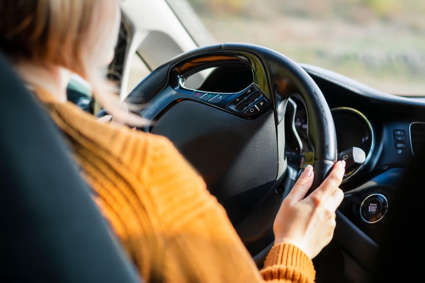 Young woman driving a car