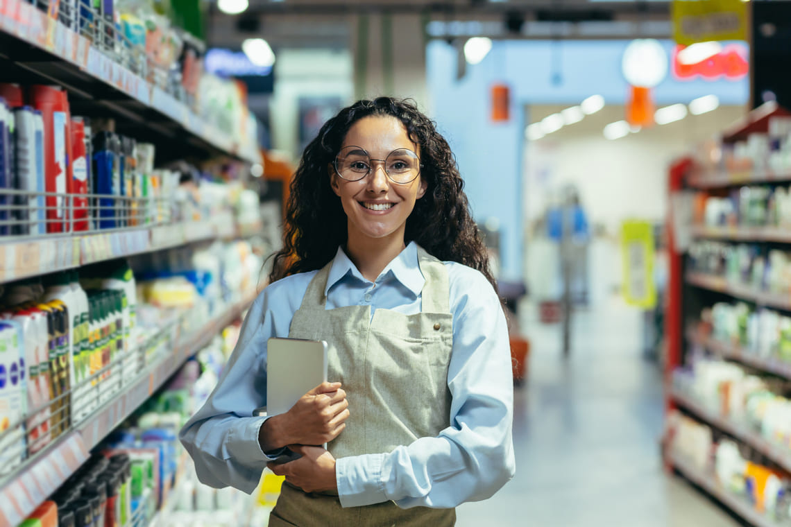 supermarket worker with ipad