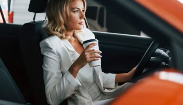 Business woman driving a car