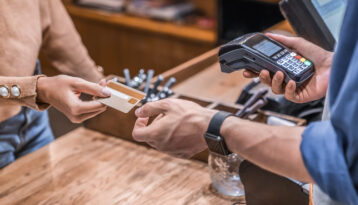 Woman paying at a restaurant