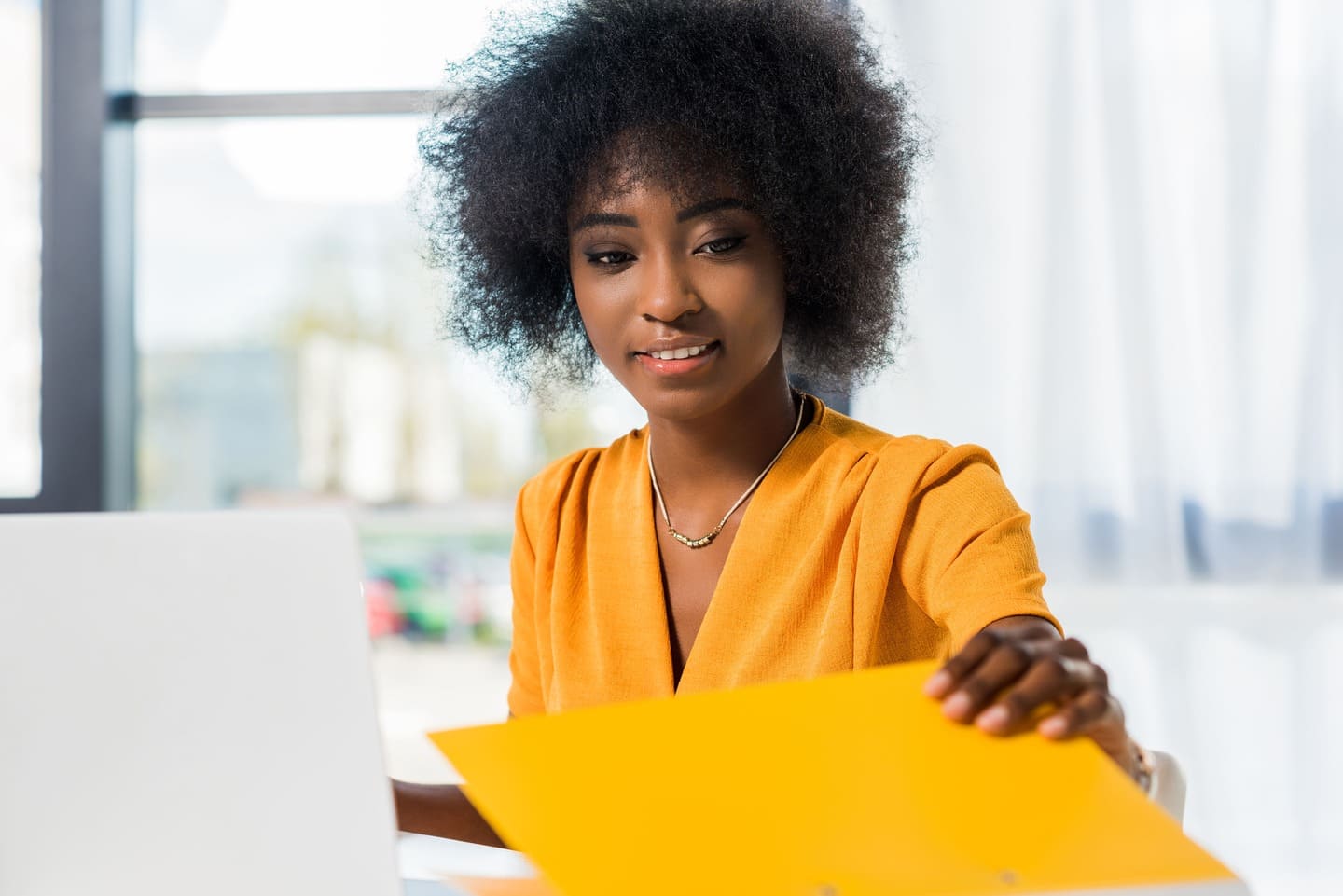 African american accountant with a yellow shirt