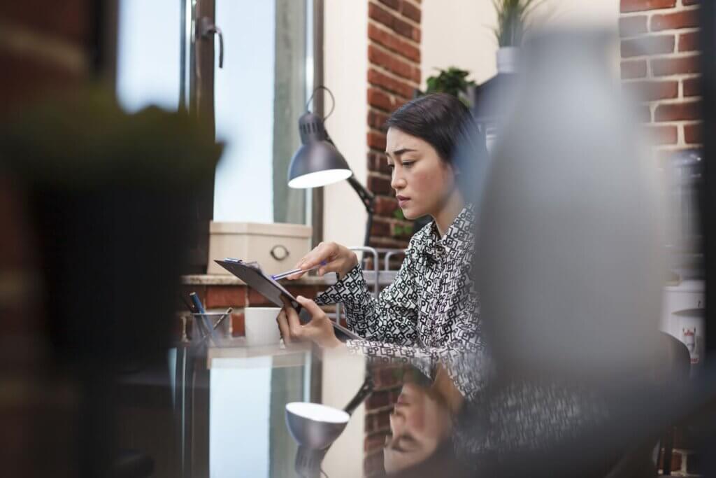 Portrait of a young female CEO looking at a tablet