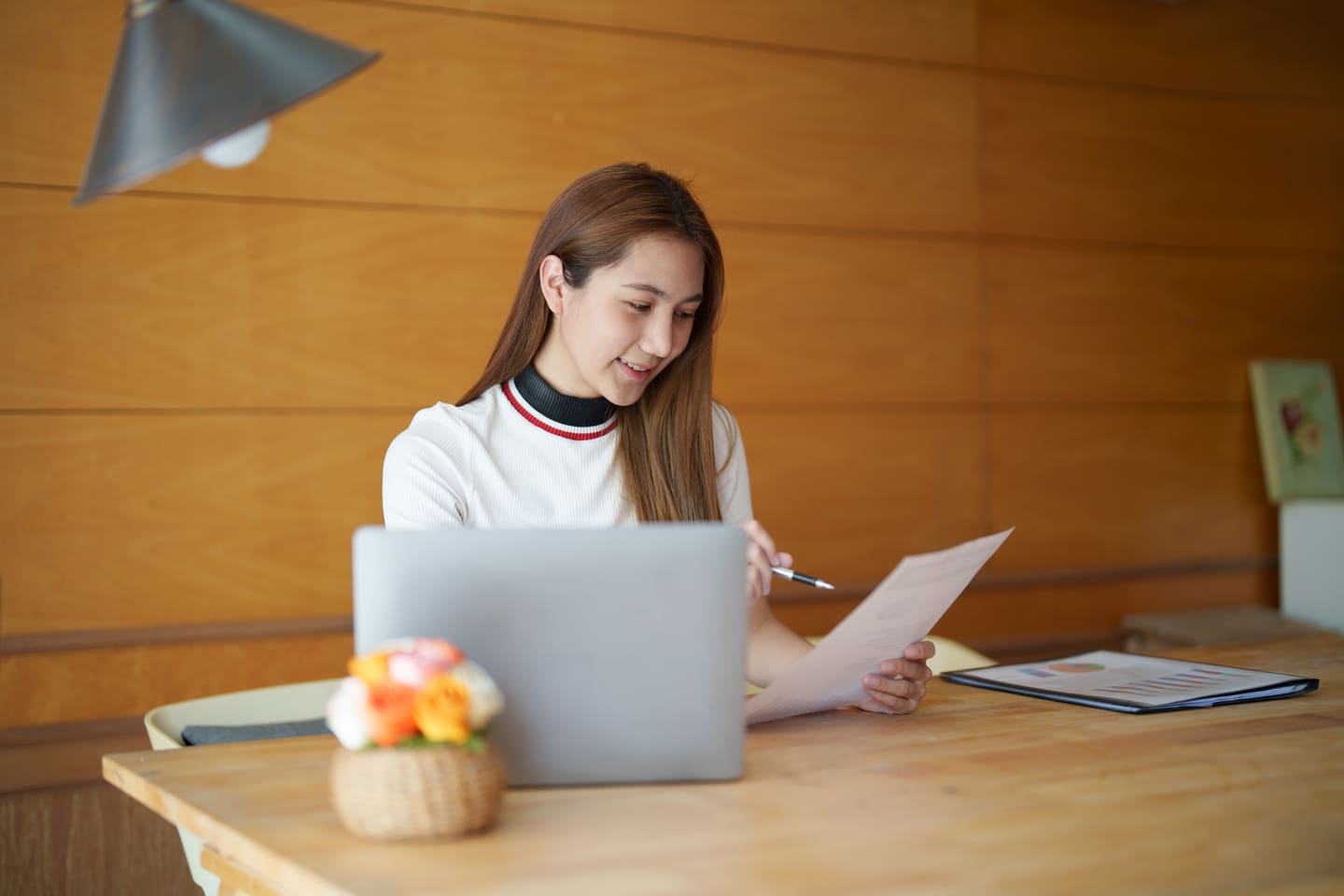 Young business woman filling forms for expense claims